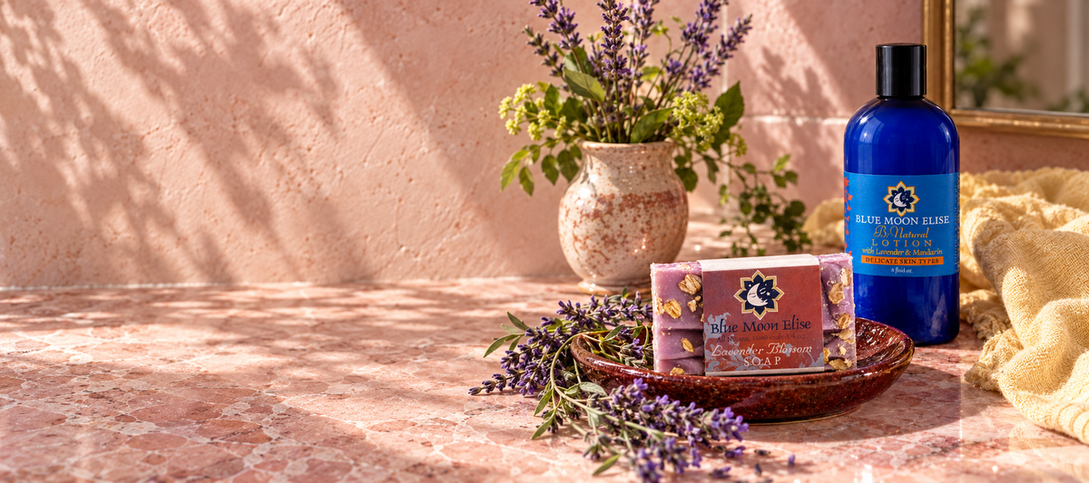 Blue Moon Elise botanical soap and lotion in a sunlit rose-colored bathroom